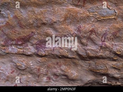 Peinture rupestre représentant des hommes et des vaches, Parc national de Tassili n'Ajjer, Tadrar Rouge, Algérie Banque D'Images