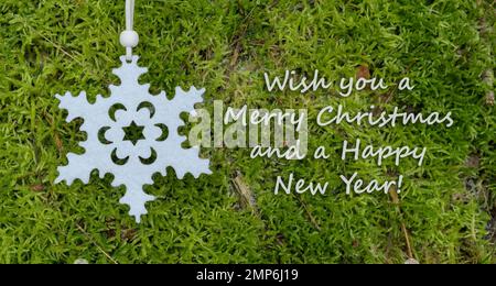 Carte de Noël avec étoile dorée et texte anglais: Je vous souhaite un joyeux Noël et une bonne année Banque D'Images