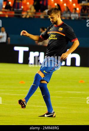 Le copain de Shakira Gerard pique (#3) joue avec le FC Barcelona dans son match avec CD Guadalajara lors du match du défi Herbalife World football au stade Sun Life de Miami, en Floride. 3rd août 2011. . Banque D'Images