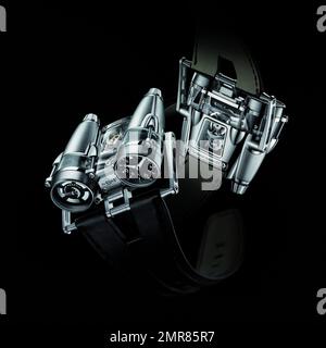 La montre-bracelet a été transformée et coûte cher ! MB&F, fabricant de montres haut de gamme, a lancé la Thunderbolt HM4, un moteur à jet exceptionnel, à un prix impressionnant de 158 000 $. Loin de la montre-bracelet traditionnelle, la HM4 Thunderbolt (ou horological machine No 4 Thunderbolt) dispose de deux cadrans montés sur deux sections en forme de moteur de jet de l'étui, l'un indiquant le temps et l'autre indiquant la réserve d'alimentation. La section saphir saisissante du boîtier qui révèle la micromécanique complexe et dynamique dans, nécessite plus de 100 heures d'usinage et de polissage pour devenir un Banque D'Images