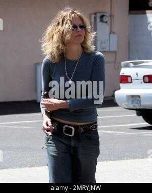 Exclusive!! Actress Meg Ryan checked that her zipper wasn't flying low  during a recently shopping trip in Santa Monica, Ca. 4/11/05 Stock Photo