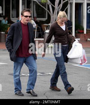 Exclusive!! Michael J Fox and wife Tracy Pollan shop at Fred Segal in Los Angeles, Ca. Fox, who is suffering from Parkinson's Disease, had noticeable tremors and kept his shaking hands in his pockets most of the time. 5/3/06 Stock Photo