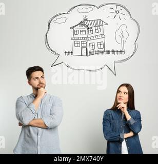 Couple rêvant d'une nouvelle maison. Illustration dans la bulle vocale Banque D'Images