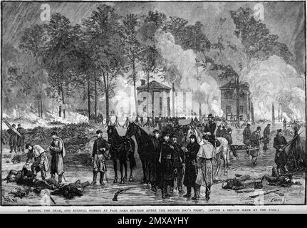 La bataille de sept pins (également connue sous le nom de bataille de Fair Oaks ou de Fair Oaks Station) a eu lieu sur 31 mai et 1 juin 1862, dans le comté de Henrico, en Virginie, dans le cadre de la campagne de la péninsule de la guerre civile américaine. C'était le point culminant d'une offensive sur la péninsule de Virginie menée par le général de division de l'Union George McClellan, dans laquelle l'armée du Potomac a atteint la périphérie de Richmond. Cette image illustre l'enterrement des morts et l'incendie des chevaux après la bataille. Banque D'Images