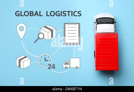 Concept de logistique globale. Chariot et icônes sur fond bleu clair Banque D'Images
