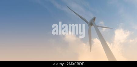 parc éolien ou ferme de moulin à vent de bannière floue, avec des éoliennes à fort vent pour la production d'électricité. Concept de production d'énergie verte. Les développeurs durables Banque D'Images