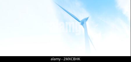 parc éolien ou ferme de moulin à vent de bannière floue, avec des éoliennes à fort vent pour la production d'électricité. Concept de production d'énergie verte. Les développeurs durables Banque D'Images