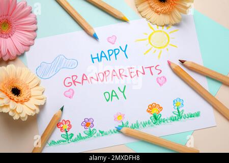 Composition de pose plate avec dessin pour grand-parents jour sur table Banque D'Images