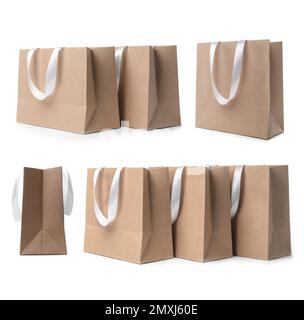 Mettez en place des sacs de shopping en papier kraft sur fond blanc Banque D'Images