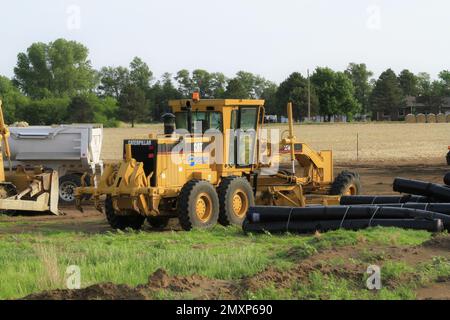Une niveleuse caterpillar sur un chantier Banque D'Images