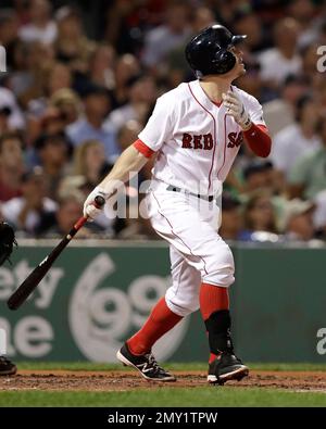 Boston Red Sox's Brock Holt, front, reacts in front of Toronto Blue Jays'  Danny Jansen after striking out to end the ninth inning of a baseball game  with the score tied in