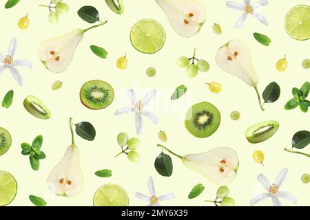 Aménagement tropical avec fruits exotiques frais et feuilles de menthe sur fond vert pâle, vue du dessus Banque D'Images