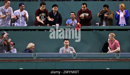 Boston Red Sox fan Lynn Hendrickson of Nashua, N.H. reacts as she is  introduced while modeling the new alternate home uniform jersey in Boston  Thursday, Dec. 11, 2008. (AP Photo/Elise Amendola Stock