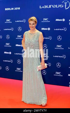 Maria Hoefl-Riesch poses for photos as she arrives for the Laureus World Sports Awards in Berlin, Germany, Monday, April 18, 2016. (AP Photo/Markus Schreiber)