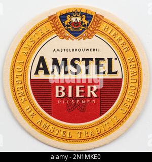 Dessous de verre en carton d'époque avec logo Amstel Beer. Amstel est une société hollandaise de brassage. Fondé 11 juin 1870 à Amsterdam, nommé d'après la rivière Amstel. Banque D'Images