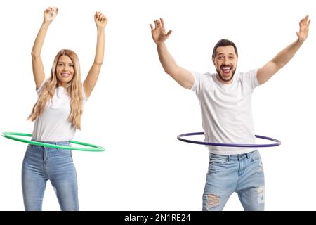 Joyeux jeune homme et femme tournant hula basket-ball isolé sur fond blanc Banque D'Images