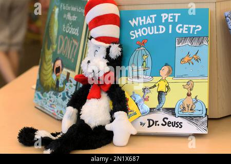 A plush “Cat in the Hat” toy is displayed next to “What Pet Should I Get?,” the latest book by Dr. Seuss, on Tuesday, July 28, 2015 at a bookstore in Concord, N.H. The book, released 24 years after the author’s death, includes the same pair of siblings featured in Seuss’s 1960 classic “One Fish Two Fish Red Fish Blue Fish.” (AP Photo/Holly Ramer)