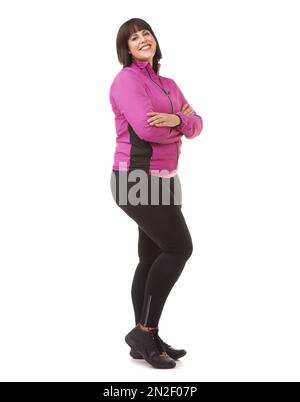 Prêt à fonctionner. Prise de vue en longueur d'un modèle de taille plus en vêtements d'exercice isolés sur du blanc. Banque D'Images