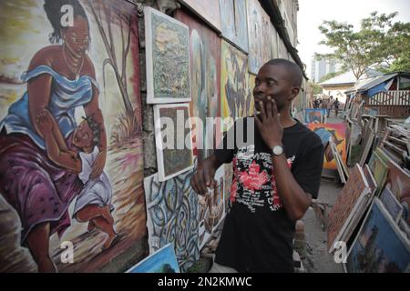 Artiste congolais visitant ses affiches à Kinshasa Banque D'Images