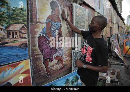 Artiste congolais visitant ses affiches à Kinshasa Banque D'Images