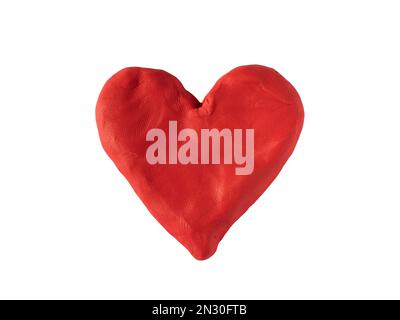 Forme de coeur en argile sur fond blanc avec passe-cheveux Banque D'Images