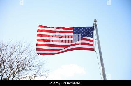 Drapeau des États-Unis ordonnant dans le ciel en arrière-plan montrant le patriotisme Banque D'Images