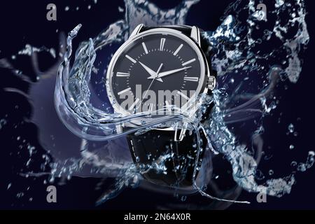 Montre de luxe pour homme aux projections d'eau pour démontrer son étanchéité Banque D'Images