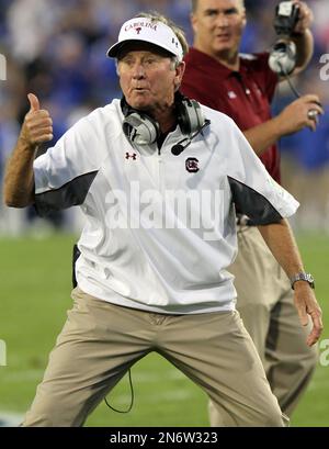 FILE - In this file photo taken Sept. 29, 2012, South Carolina coach Steve Spurrier gestures to an official during the first quarter of an NCAA college football game against Kentucky in Lexington, Ky. Spurrier loves to defeat North Carolina. He'll get another chance when the sixth-ranked Gamecocks open the season against the Tar Heels on Thursday night, Aug. 29, 2013. (AP Photo/James Crisp, File)