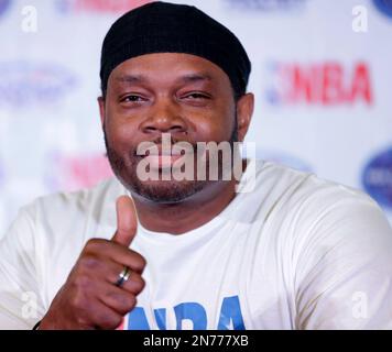 Visiting American basketball player Sam Perkins, a former member of the Indiana Pacers, flashes the thumbs up sign during a news conference Tuesday, July 2, 2013 to launch the 100 Days countdown to promote the upcoming preseason NBA games between the Indiana Pacers and the Houston Rockets in Manila, Philippines. The NBA Global Games will see eight NBA teams playing in six countries as the Philippines, China, Brazil, Spain, England and Taiwan. (AP Photo/Bullit Marquez)