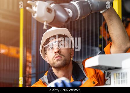Ingénieur d'automatisation Service de vérification du bras robotique. Concept de l'industrie moderne de la fabrication automatique de machines. Banque D'Images