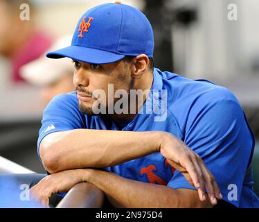 FILE - In this file photo taken Aug. 10, 2012, New York Mets pitcher Johan Santana watches from the dugout a baseball game in New York. Santana is headed to the disabled list and not expected to pitch again this season. General manager Sandy Alderson said Wednesday, Aug. 22, 2012, that the left-hander was going on the 15-day DL with inflammation in his lower back. (AP Photo/Bill Kostroun, file)