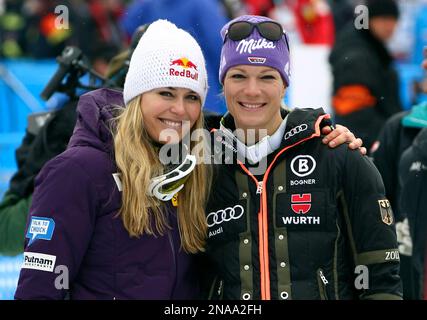 Lindsey Vonn, of the United States, left, poses with Germany's Maria Hoefl-Riesch after completing a women's World Cup downhill on the Sochi Olympics course, in Krasnaya Polyana, near Sochi, Russia, Saturday, Feb.18, 2012. Vonn clinched her fifth consecutive World Cup downhill title Saturday, although German rival and friend Maria Hoefl-Riesch won the race on the 2014 Sochi Olympics course. (AP Photo/Alessandro Trovati)