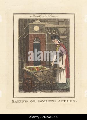 Femme vendeuse de pommes à Stratford place, Londres. Femme en bonnet, manteau, tablier et jupes, avec brouette pleine de pommes, vendue chaude en hiver. Cuisson ou ébullition des pommes ! Gravure de plaques de copperplate de couleur main par Edward Edwards, d'après une illustration de William Marshall Craig de Description des plaques représentant les Itinerant Traders de Londres, Richard Phillips, n° 71 St Paul's Churchyard, Londres, 1805. Banque D'Images