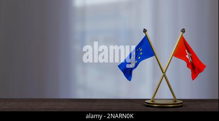 Drapeaux de Hong Kong et d'Europe sur la table. Négociation entre Hong Kong et l'UE. sur un arrière-plan peu flou. 3D travaux et 3D images Banque D'Images