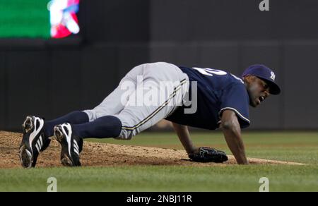 Milwaukee Brewers pitcher LaTroy Hawkins falls as he delivers against the  Minnesota Twins in a baseball game Friday, July 1, 2011 in Minneapolis. (AP  Photo/Andy King Stock Photo - Alamy