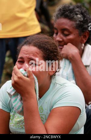 Caterine Zapata, wife of miner Jorge Lara, reacts at La Preciosa mine