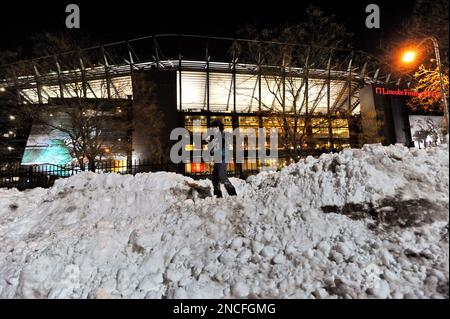 Garrett Jenkins, 11, of Mertztown, Pa., throws a snowball in the parking  lot of Lincoln Financial Field before an NFL football game between the  Philadelphia Eagles and the Minnesota Vikings, Tuesday, Dec.