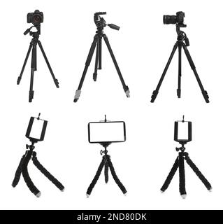Set avec trépieds modernes sur fond blanc Banque D'Images