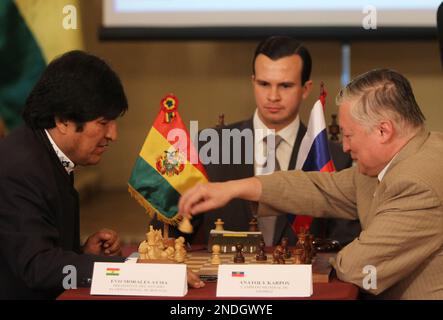 Former chess world champions Garry Kasparov, right, and Anatoly Karpov,  left, play an exhibition rematch in Valencia, Spain, Tuesday, Sept. 22,  2009. Chess eminences Kasparov and Karpov are dusting off their knights