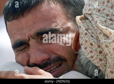 A Pakistani Man Mourns Over The Death Of His Relative, Who Was Killed ...