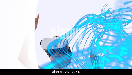 Composition de pistes lumineuses numériques avec un garçon portant un casque vr Banque D'Images