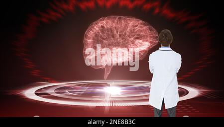 Composition d'un médecin de sexe masculin utilisant un écran virtuel avec modèle cérébral Banque D'Images