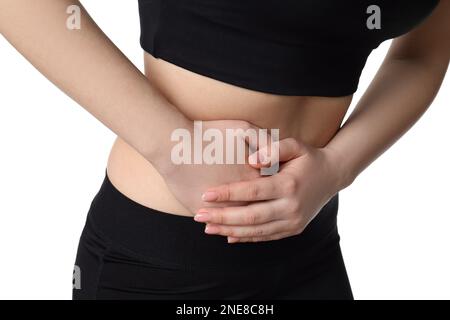 Femme souffrant de douleurs dans le bas de l'abdomen droit sur fond blanc, gros plan. Appendicite aiguë Banque D'Images