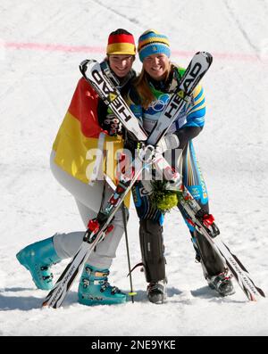 Germany's Maria Riesch, left, winner of the Women's super combined event, poses with bronze medal's winner Anja Paerson of Sweden, at the Vancouver 2010 Olympics in Whistler, British Columbia, Thursday, Feb. 18, 2010. (AP Photo/Charlie Riedel)