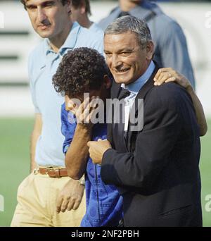 Italian soccer star Robert Baggio left weeps on the shoulder of former soccer superstar Gigi Riva after Italy s 2 1 victory over Bulgaria in the semifinal World Cup soccer match at Giant s Stadium Eas...