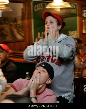 Boston Red Sox fan Lynn Hendrickson of Nashua, N.H. reacts as she is  introduced while modeling the new alternate home uniform jersey in Boston  Thursday, Dec. 11, 2008. (AP Photo/Elise Amendola Stock