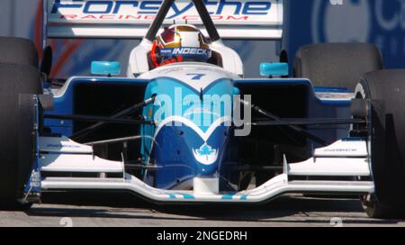 Bruno Junqueira, of Belo Horizonte, Brazil, guides his Ford-Cosworth Lola  for Neman/Haas Racing through the nine turn of the course of the Grand Prix  of Denver with other racers behind him on