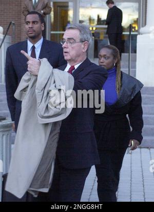 Jayson Williams defense team members, from left, attorney Billy Martin,  spokeswoman Judy Smith and attorney Joseph A. Hayden Jr. walk arm in arm  from the Somerset County Courthouse in Somerville, N.J., following