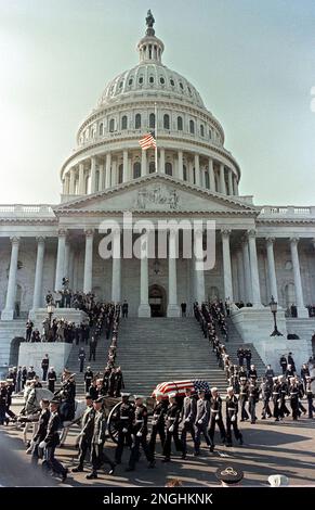 The caisson bearing the flag-draped casket of assassinated President John F. Kennedy pauses in front of the U.S. Capitol in Washington D.C., en route to the grave site at Arlington National Cemetery on Nov. 25, 1963. (AP Photo)