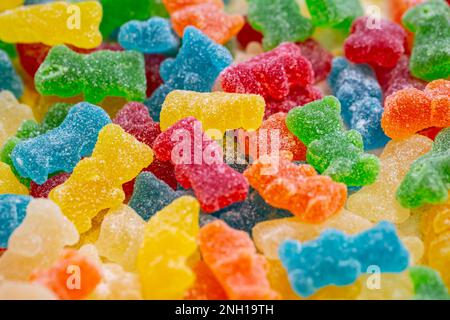 Bonbons en gelée en forme d'ours, fond de texture. Banque D'Images